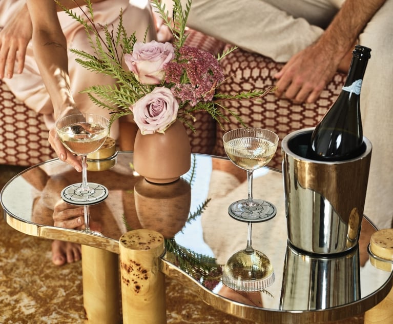 Close up of a bottle of wine and glasses sitting on a table
