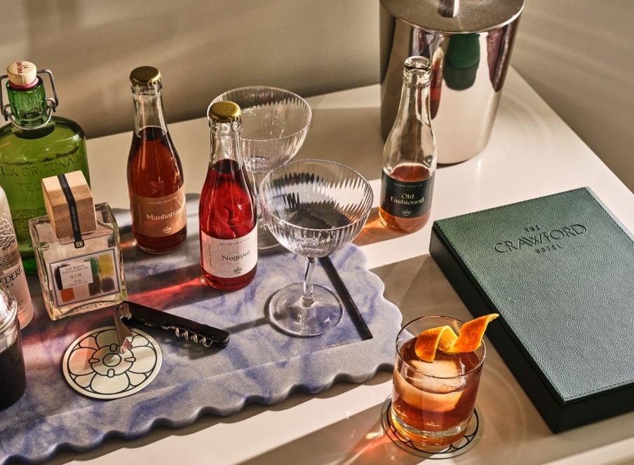 A bar cart with an assortment of ingredients.
