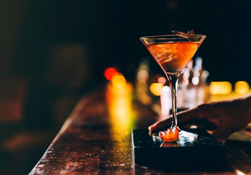 A cocktail being presented at the bar of Williams & Graham in Denver Colorado.