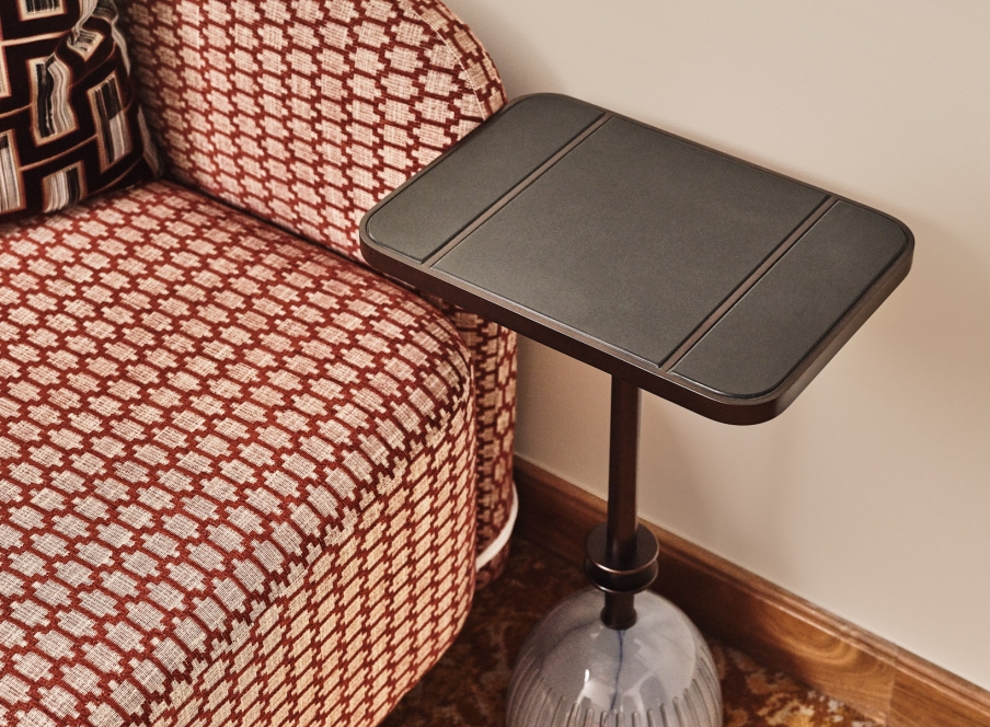 close up of a stool next to a chair