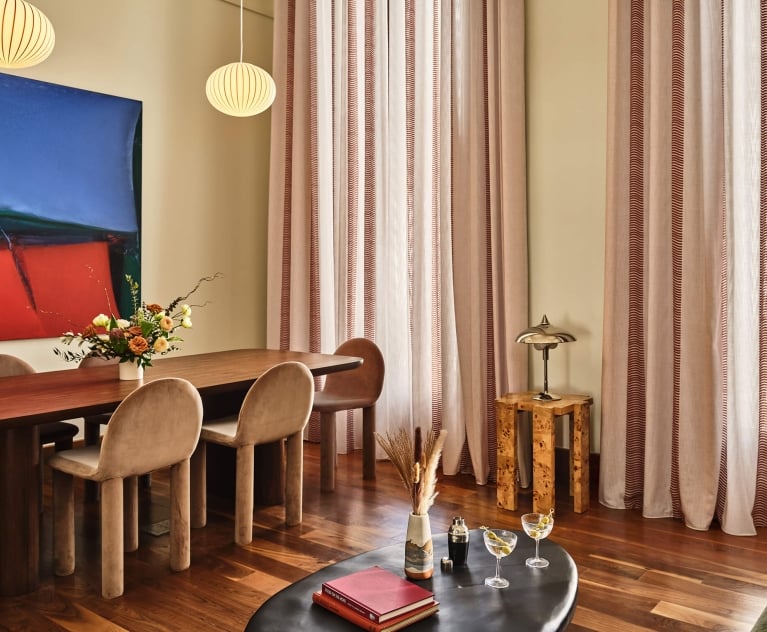 A large dining table in the living area of the Crawford Suite at the Crawford Hotel in Denver, Colorado.