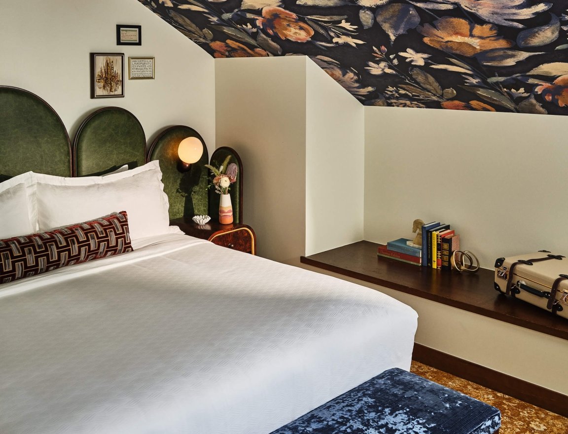 King bed in the Premium Loft Guest Room at the Crawford Hotel in Denver, Colorado.