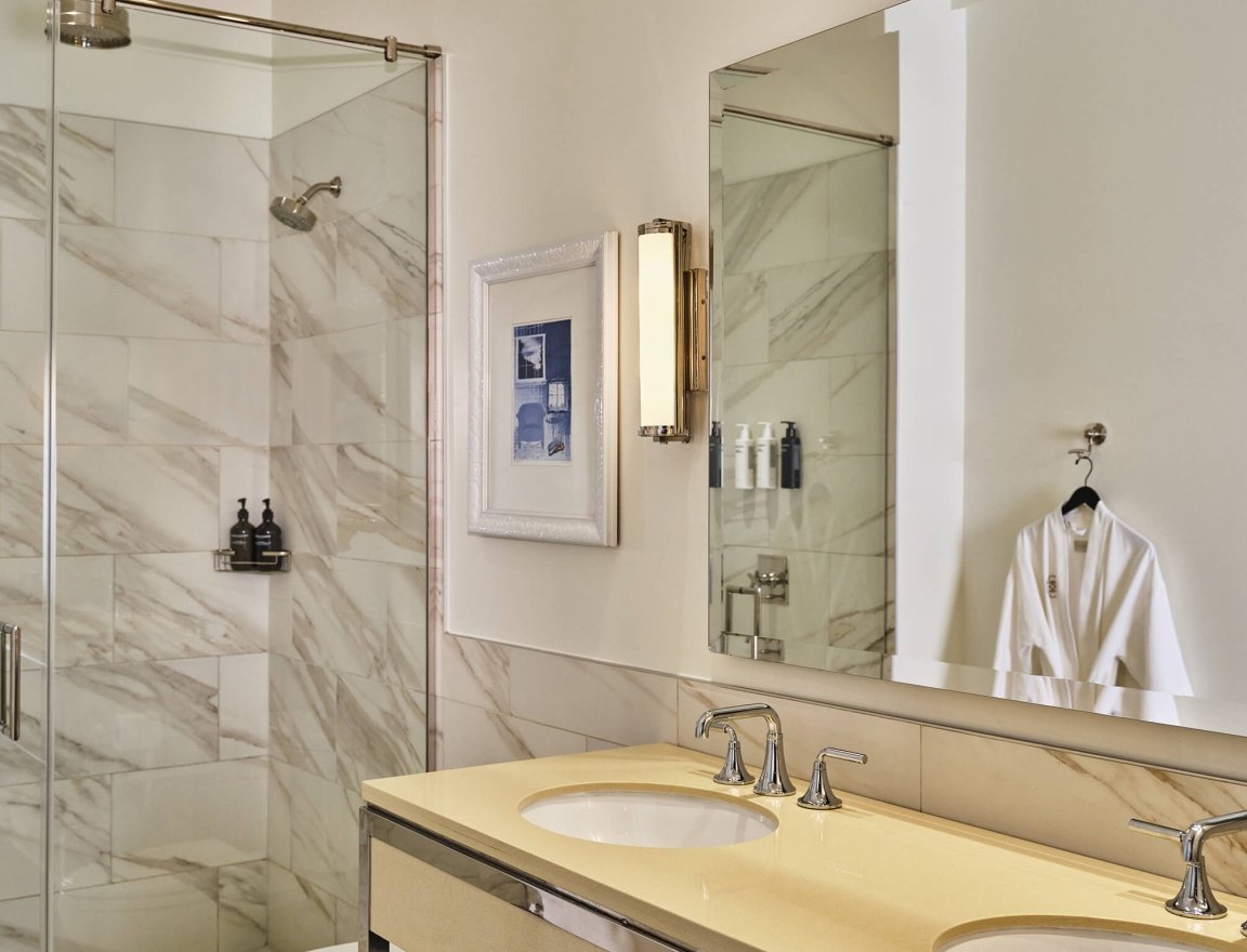 The bathroom of the Deluxe Classic Guest Room at the Crawford Hotel in Denver, Colorado.