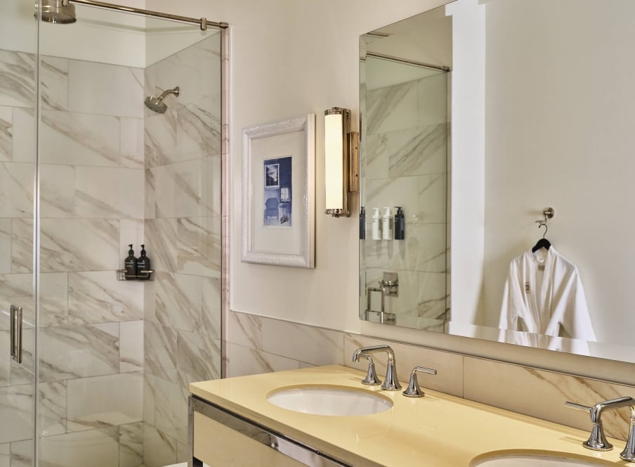 The bathroom of the Deluxe Classic Guest Room at the Crawford Hotel in Denver, Colorado.