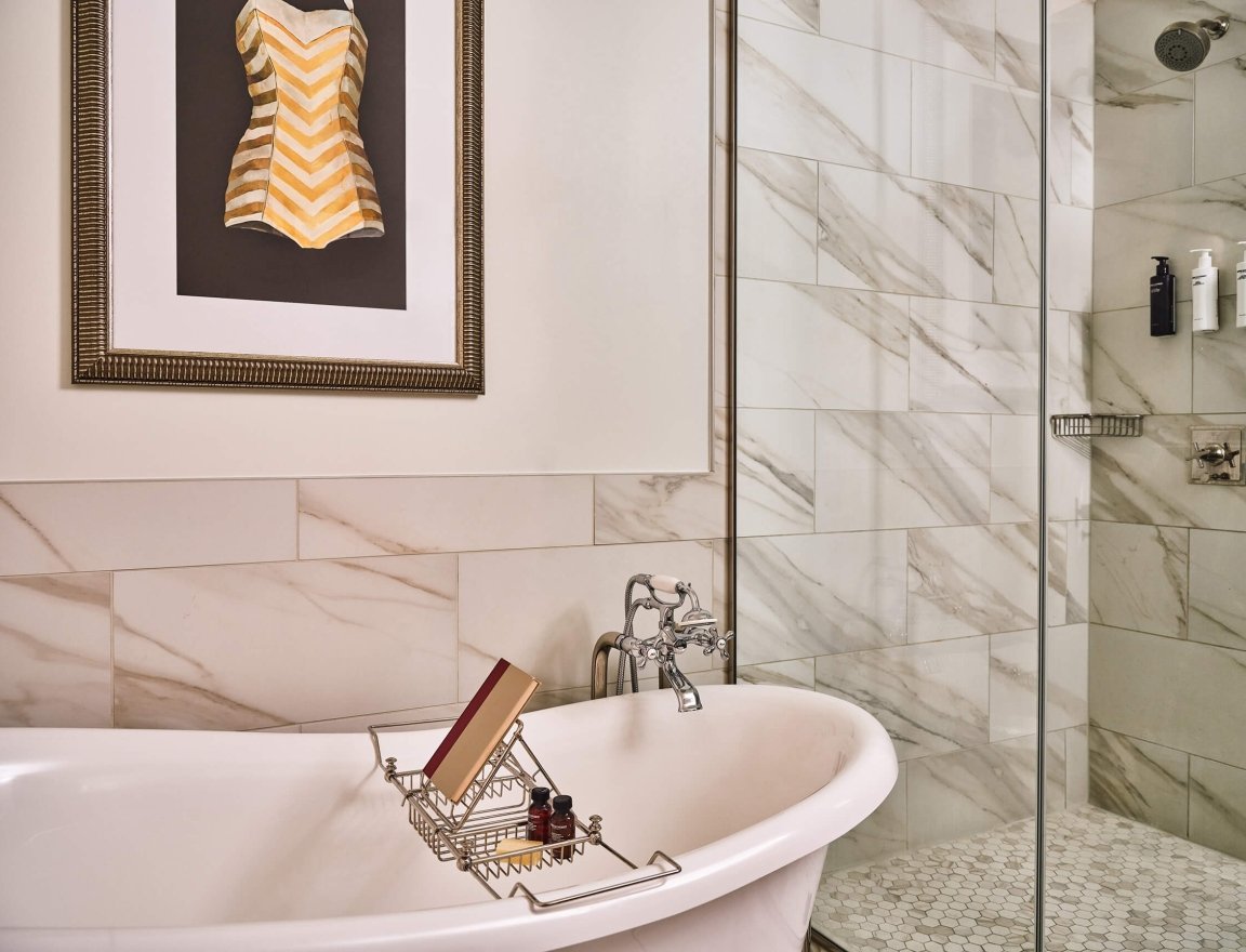 The bathroom of the Premium Classic Guest Room at the Crawford Hotel in Denver, Colorado.