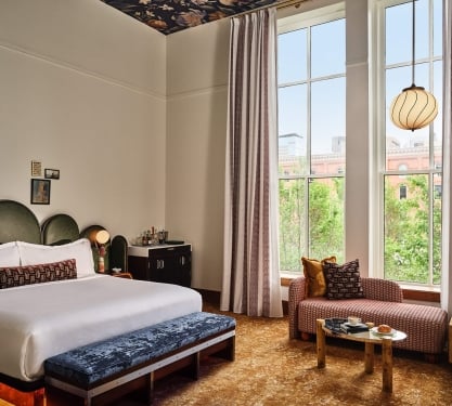 A king bed in the Premium Classic Guest Room at the Crawford Hotel in Denver, Colorado.