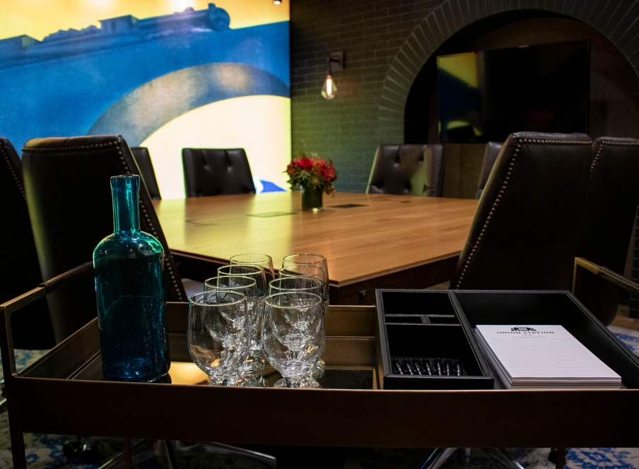 A refreshment cart in front of a boardroom table in the Larimer Boardroom at the Crawford Hotel in Denver, Colorado.