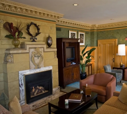 A comfy living area of a hotel suite.