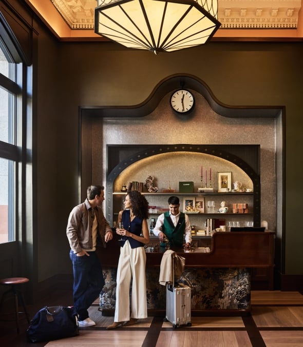Man and Woman checking in to Crawford Hotel