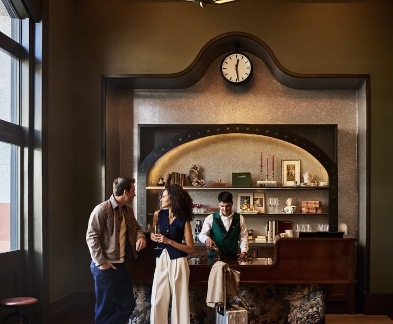 Man and Woman checking in to Crawford Hotel