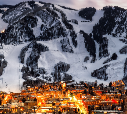 snowy mountains overlooking a city