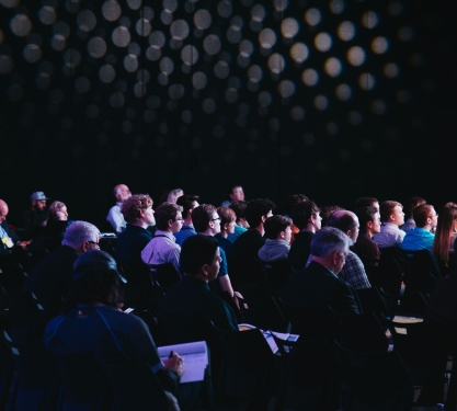 people sitting in an auditorium for a ETH conference