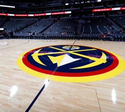 The Ball Arena with a close up of the denver nuggets logo