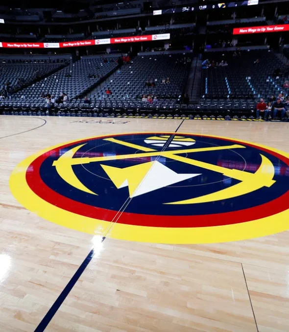 The Ball Arena with a close up of the denver nuggets logo
