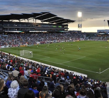 crowd of people watching a soccer match