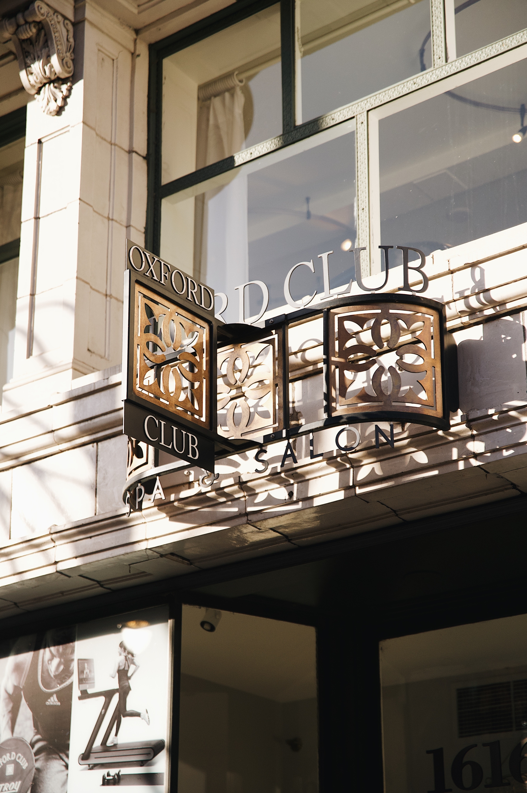 exterior of the Oxford Club building with a close up of the logo