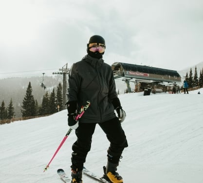 A skier in gear on a mountain