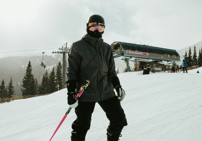 A skier in gear on a mountain