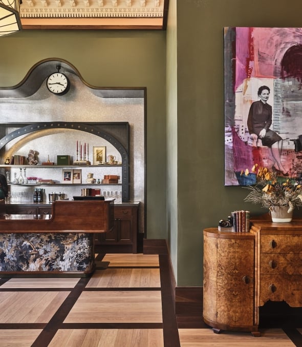 The Crawford Hotel front desk with staff behind the counter