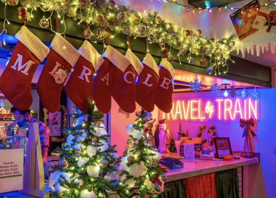 A room decorated for christmas with stockings hanging