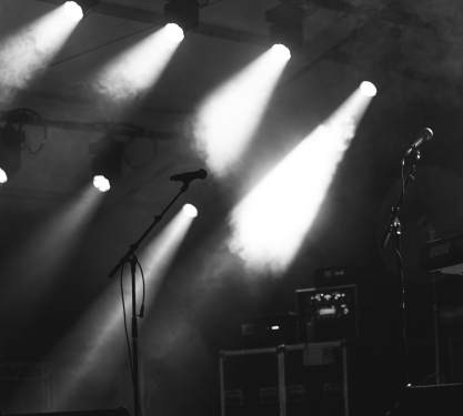 Black and White image of microphone and stage lights