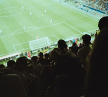 Fans cheering at soccer game