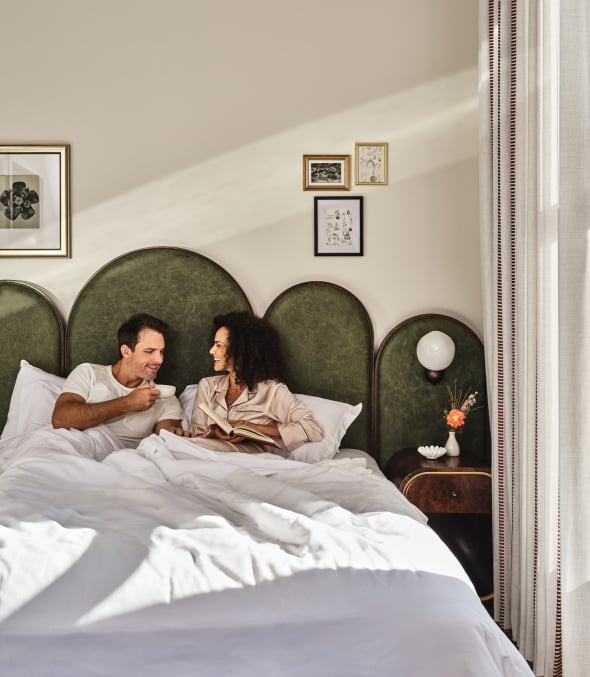 Couple sitting in bed